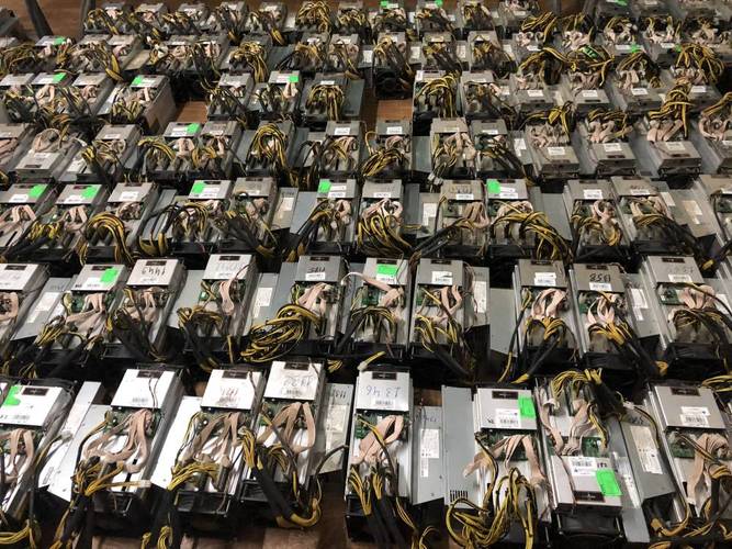 Bitcoin mining rig undergoing maintenance and repair